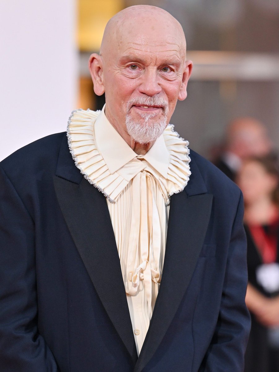 luresmagazine's tweet photo. Only day two of the #VeniceFilmFestival and we might already have the best fit. John Malkovich stepped out for the "Wild Horse Nine" screening wearing a fresh-off-the-runway Dior Fall 2026 shirt with a striking ruffled collar. Masterclass tailoring! 

#Lures #JohnMalkovich https://t.co/k5nWROChIK