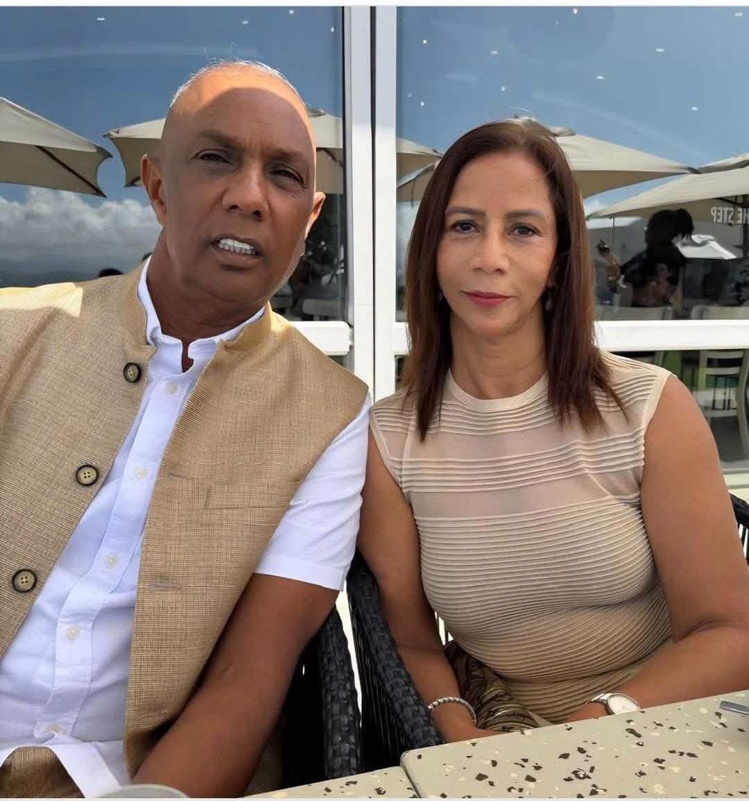 AdvoBarryRoux's tweet photo. The first picture is of recently arrested human trafficker & drug dealer Timmy Marimuthu with his daughter Shantal Rhedi.  The second picture is of Shantal Rhedi with her Audi Q7 SUV, & this is the same Audi Q7 that was used to traffic the girls that Timmy Marimuthu is arrested for. Timmy Marimuthu's daughter Shantel Rhedi is still a Lt Colonel employed by SAPS Crime Intelligence KZN