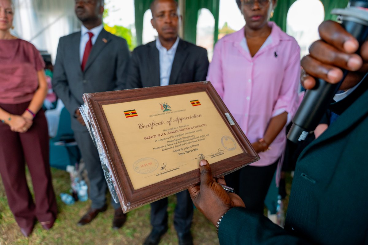 Amref_Uganda's tweet photo. The HEROES for Gender Transformative Action  concluded with a moment of appreciation for the partners and districts whose commitment helped drive six years of transformation.

The recognition celebrated the collective effort behind the programme bringing together government, district local governments, development partners, civil society, communities, health workers, teachers and young people.

From strengthening health systems and improving access to SRHR services to empowering young people and supporting communities to address SGBV, HEROES has been a journey built on partnership.

The event also recognized the nine districts where the programme has worked, acknowledging their role in implementing interventions, strengthening local systems and ensuring that the programme's work reached communities.

The presentation of appreciation awards and certificates, together with the handover of legacy boards to district representatives, provided a meaningful conclusion to the six-year journey. The legacy boards symbolised each district's commitment to sustain the gains and legacy of HEROES4GTA.

As we celebrate the achievements of the programme, we also recognise that lasting change is never the work of one organisation. It is built through shared responsibility, collaboration and continued commitment.

To all our partners, district leaders, local governments, health workers, community organisations, teachers, young people and everyone who contributed to HEROES4GTA:

Thank you for six years of partnership, empowerment and gender transformation.

The programme may be closing, but the responsibility to sustain its gains continues.

What to take forward from HEROES: the partnerships, the lessons and the commitment to keep building stronger communities.
#HEROES4GTA #HEROESLegacy