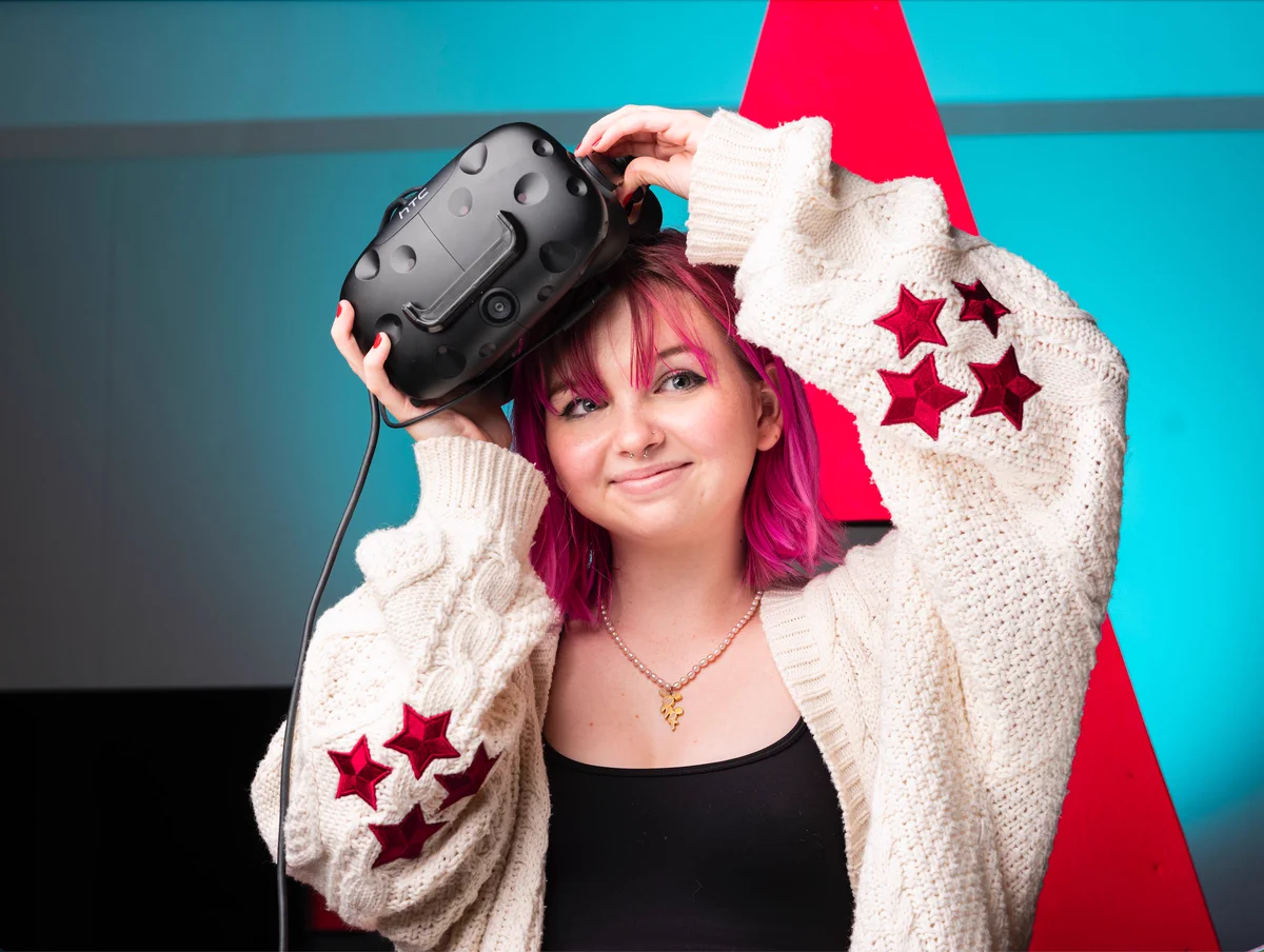 Woman takes off VR headset