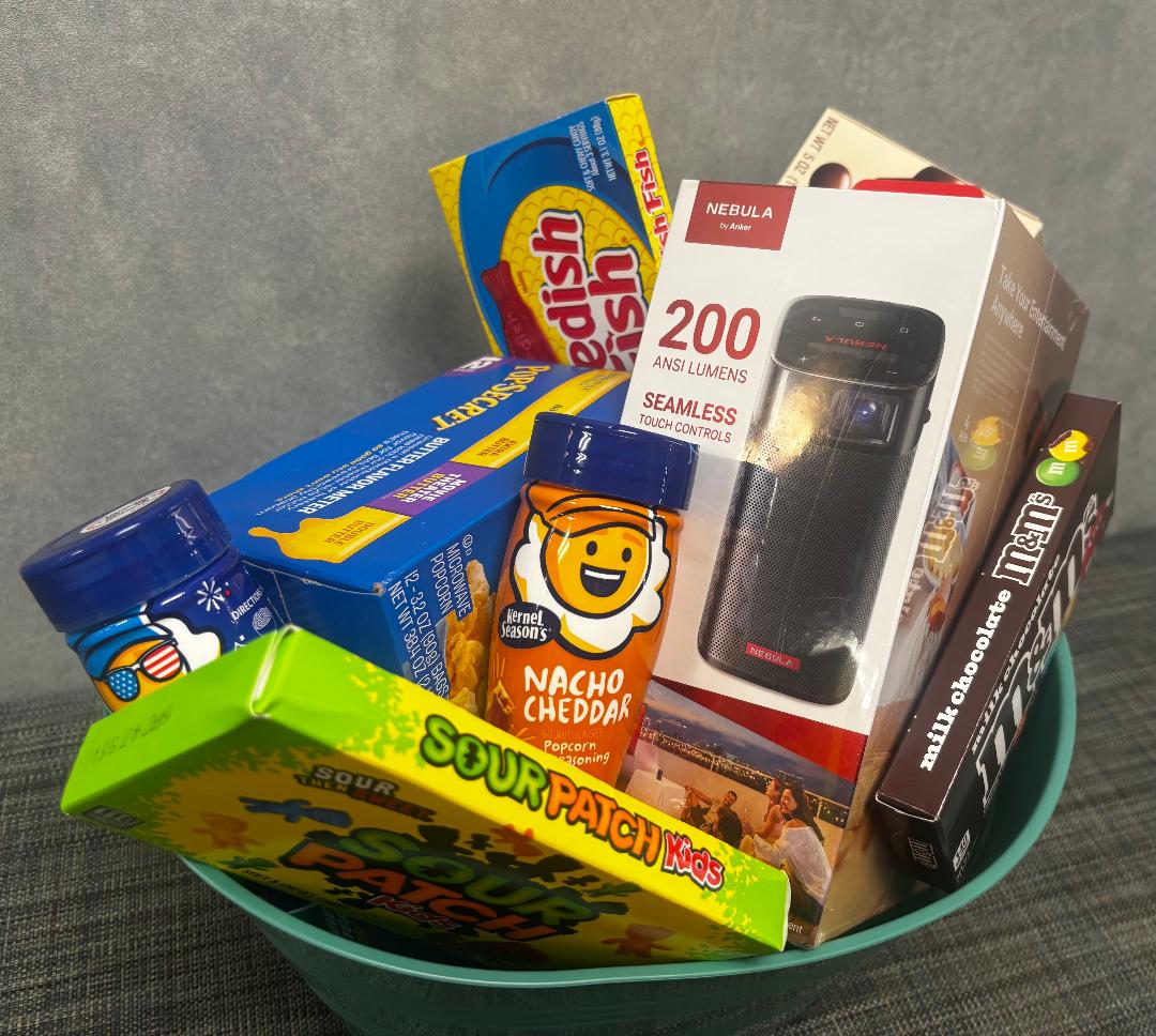 CCCCchildcare's tweet photo. 🍿🎬 LIGHTS, CAMERA, MOVIE NIGHT! 
Our latest #CCCC Silent Auction basket has everything you need for a movie night at home!

📽️ BRAND-NEW, factory-sealed Anker Nebula Apollo projector
🍿 Popcorn + theater candy
🧀 2 popcorn seasonings
💰 Value: $300

Bidding opens Sept. 17! https://t.co/JCnZS7xpk5