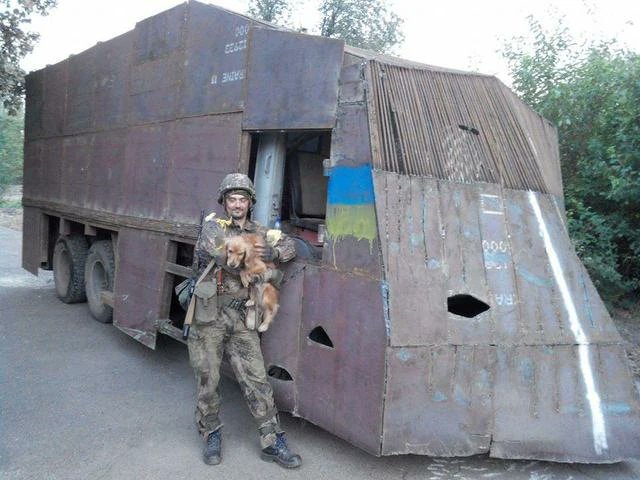 doctoradmiral's tweet photo. Dnipro-1 Battalion fighter with his dog next to The Contraption
Summer 2014 https://t.co/AZF4ijfTvH