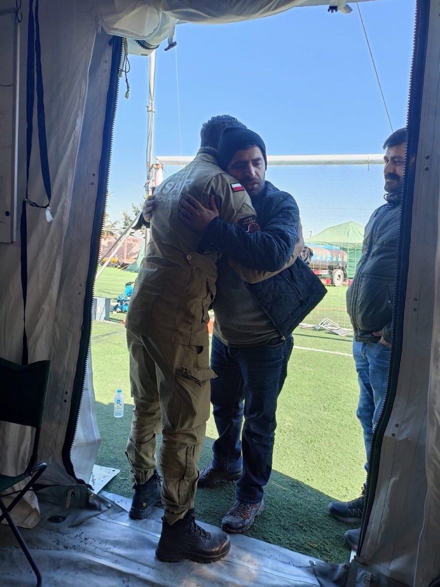 TurkishArc's tweet photo. A Turkish citizen hugging Polish rescue ISAR team member for everything they’ve done after the earthquake, 2023. https://t.co/MNnGFklRRc