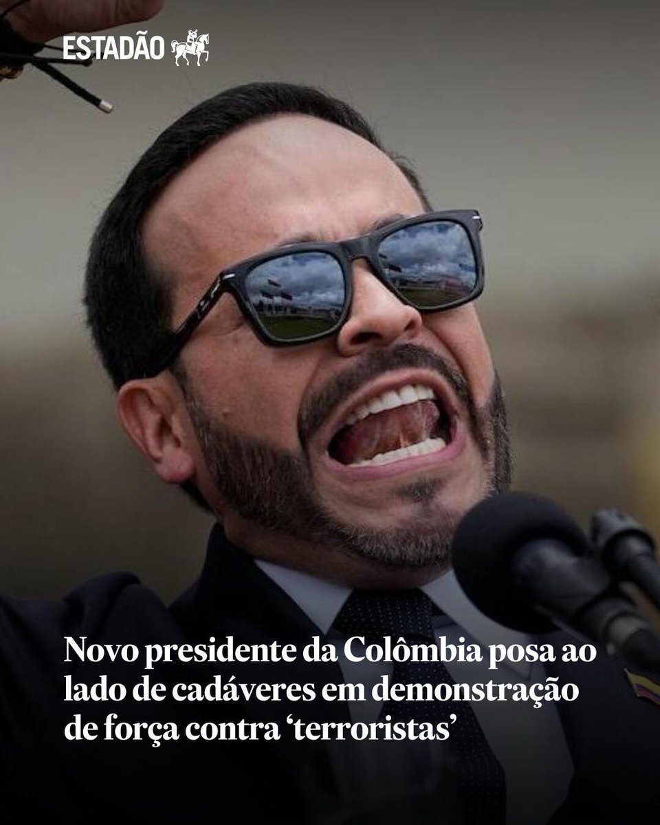 Estadao's tweet photo. Novo presidente da Colômbia posa ao lado de cadáveres em demonstração de força contra ‘terroristas’ https://t.co/SFxo04imSX https://t.co/zxm2NVbjt0