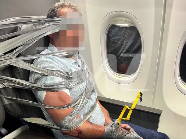 BigBull778's tweet photo. 🚨 A passenger was reportedly restrained with duct tape and zip ties after an alleged outburst on an American Airlines flight.

According to TMZ, the man allegedly directed a racial slur at a Black flight attendant before becoming violent, reportedly hitting another passenger and pushing a woman who attempted to intervene.

Passengers eventually helped restrain him as the flight was diverted to Baltimore, where authorities took him into custody. 😳✈️