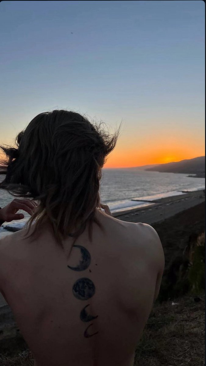kookminini's tweet photo. opening instagram to jimin with his shirt off and his moon tattoos down his back while his blonde hair is down and a sunset in the back is everything like he’s so gorgeous https://t.co/eBUHyykTxf