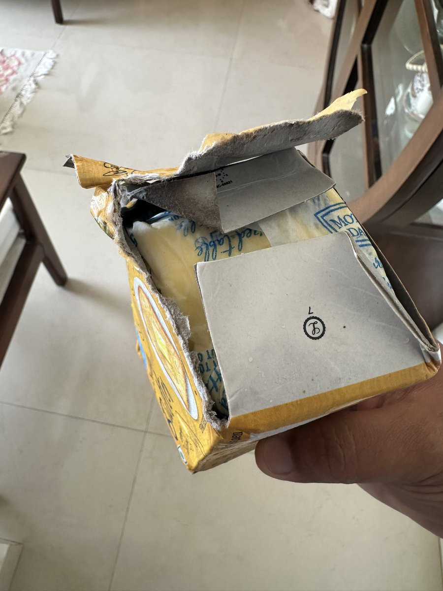 vikramdandekar's tweet photo. @FDA_MAHARASHTRA This is how Blinkit has delivered the butter. This was in their brown bag. Please do a through inspection of their store at Bandra W, Mount Mary Steps at the earliest. https://t.co/jcWGfots9x