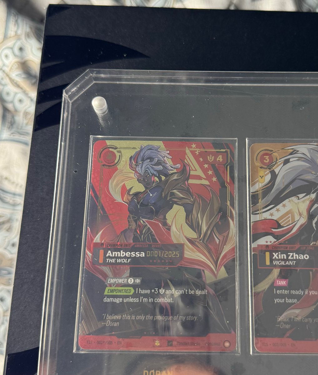 suneatergames's tweet photo. 🚨 DORAN AMBESSA #0001/2025 HAS BEEN FOUND. 

After reviewing multiple photos from different angles, #0001 is now VERIFIED on the SunEater Games T1 Tracker

One of the biggest possible serials is officially off the board. 🔥

Huge congrats to rollingtimetcg on an insane pull

DORAN. AMBESSA. 0001.
https://t.co/sK9l8qWgLt
HUNT THEM ALL.
#riftbound #tcg #riftboundtcg