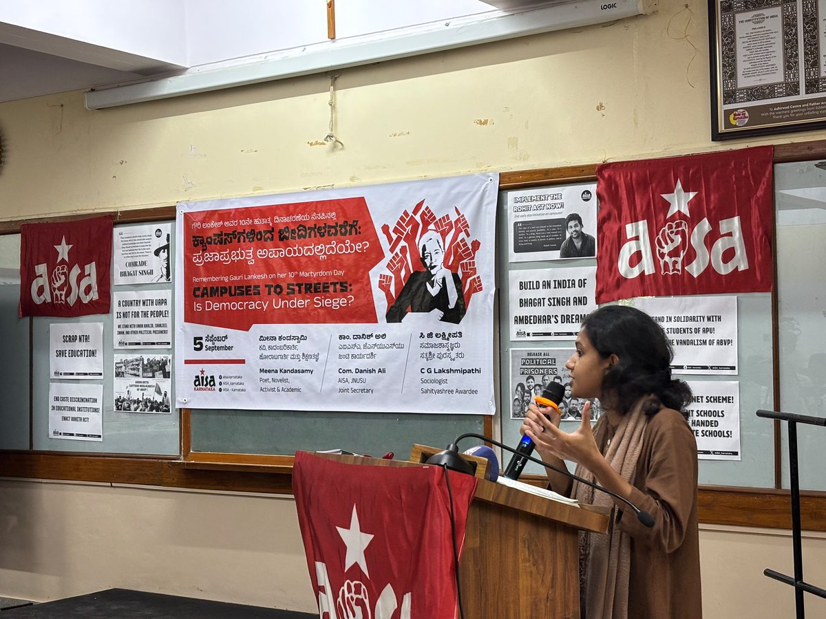 newstapworld's tweet photo. Bengaluru: AISA organised “Campuses to Streets: Is Democracy Under Siege?”, bringing together students, activists and academics to discuss dissent, democracy and what speakers described as growing attacks on public education and democratic spaces under the BJP-led government.

JNUSU Secretary Com. Danish Ali recalled the courage and legacy of Gauri Lankesh, warning that activists and dissenters increasingly face repression for speaking against the government. She criticised the growing privatisation and saffronisation of education and said student participation in politics was essential to defending democratic rights.

Sociologist Dr Lakshmipathi C G spoke about caste discrimination and communal divisions within educational institutions, saying classrooms were increasingly turning into “caste-rooms” and “communal-rooms.” He also criticised the growing privatisation of education in Karnataka and the weakening of scientific thinking.

Author Meena Kandasamy spoke on censorship and the shrinking space for dissent, referring to Gauri Lankesh’s assassination as a chilling moment for activists and journalists. She argued that attempts to label and delegitimise dissenting voices were being used to suppress ideas that challenged the dominant political ideology.

The programme also saw the launch of AISA’s booklet, “Education Under Siege,” examining the condition of education in India with a special focus on Karnataka. The evening concluded with a cultural performance by AISA members and drew an audience of over 150 people.

@AISA_tweets @AISA_karnataka @meenakandasamy