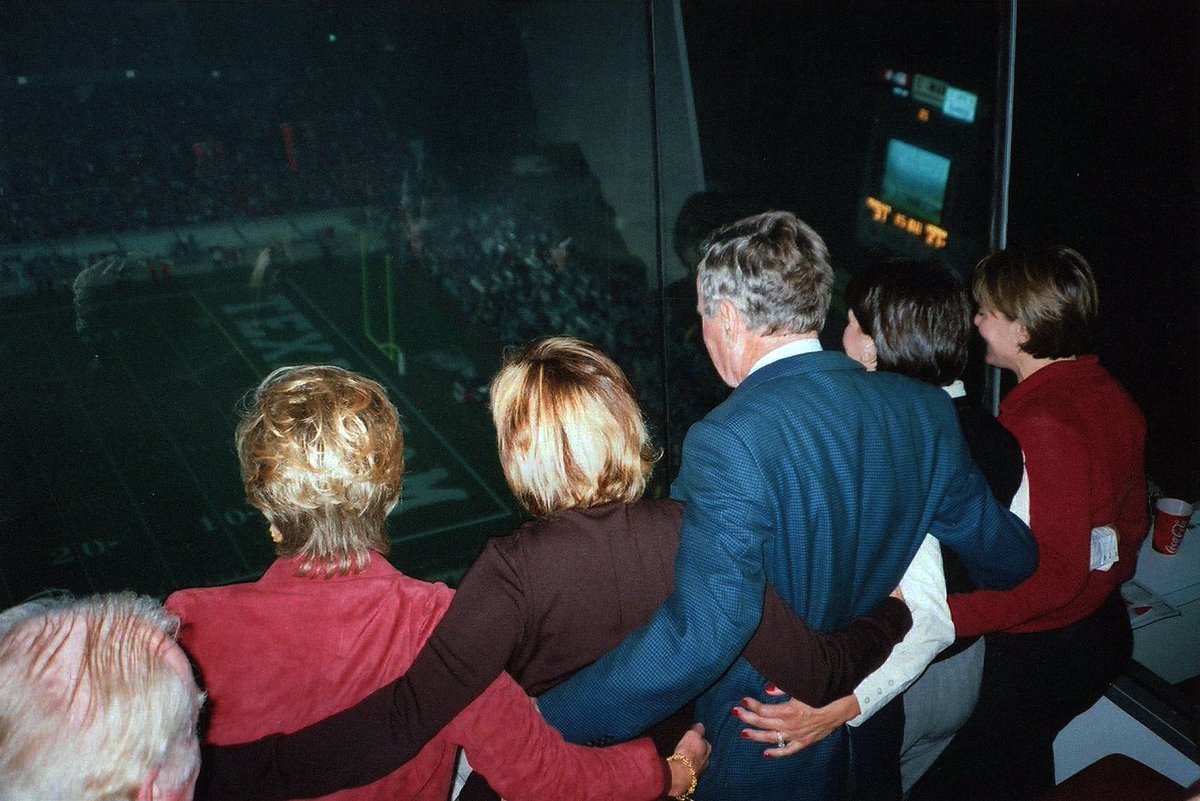 Bush41Library's tweet photo. Football season has returned to Aggieland! Gig 'em, Aggies! 🏈

Photo Note: Discovered in one of Mrs. Bush’s scrapbooks covering March 2002 to March 2003, this photograph depicts the President alongside others "sawing 'em off" in a suite during a Texas A&amp;M football game. https://t.co/0nzLaZxwuY