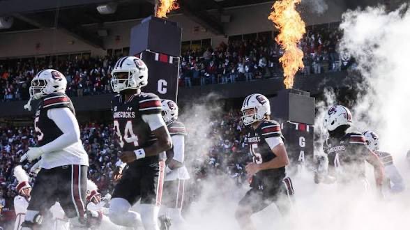 SharpsideMob's tweet photo. 🏈 COLLEGE FOOTBALL PLAY 🏈

Kent State/South Carolina OVER 53.5

Projected score: South Carolina 47, Kent State 11

This is my favorite total.

South Carolina’s offense is the central reason. The Gamecocks have a new offensive coordinator and spent the offseason specifically addressing an offensive line that surrendered 43 sacks and 88 tackles for loss last year. The expectation is a much more reliable running game around LaNorris Sellers plus multiple legitimate receiving options. 

Kent State’s defense is where the ceiling comes from. Last season, its three nonconference road losses came by a combined 172-24. This is a defense that can allow South Carolina to get into the mid-to-upper 40s almost by itself. 

But I don’t need Kent completely shut out. QB Dru DeShields gives the Golden Flashes enough mobility and passing ability that 7-14 points is realistic—especially once South Carolina begins rotating defensive personnel. That’s exactly what separates this from betting South Carolina -36.5: garbage time can help the over rather than kill the spread. 

Your number is also valuable. The broader market has been around 54.5, while your screenshot gives us 53.5. The handicap I found specifically rated the over playable through 54 and projected South Carolina around 45-48 with Kent capable of 10-14. 

Weather is hot—around 93°F—but dry with only ~4 mph wind. Passing and kicking conditions are fine; if anything, the heat can accelerate defensive fatigue for the thinner roster.