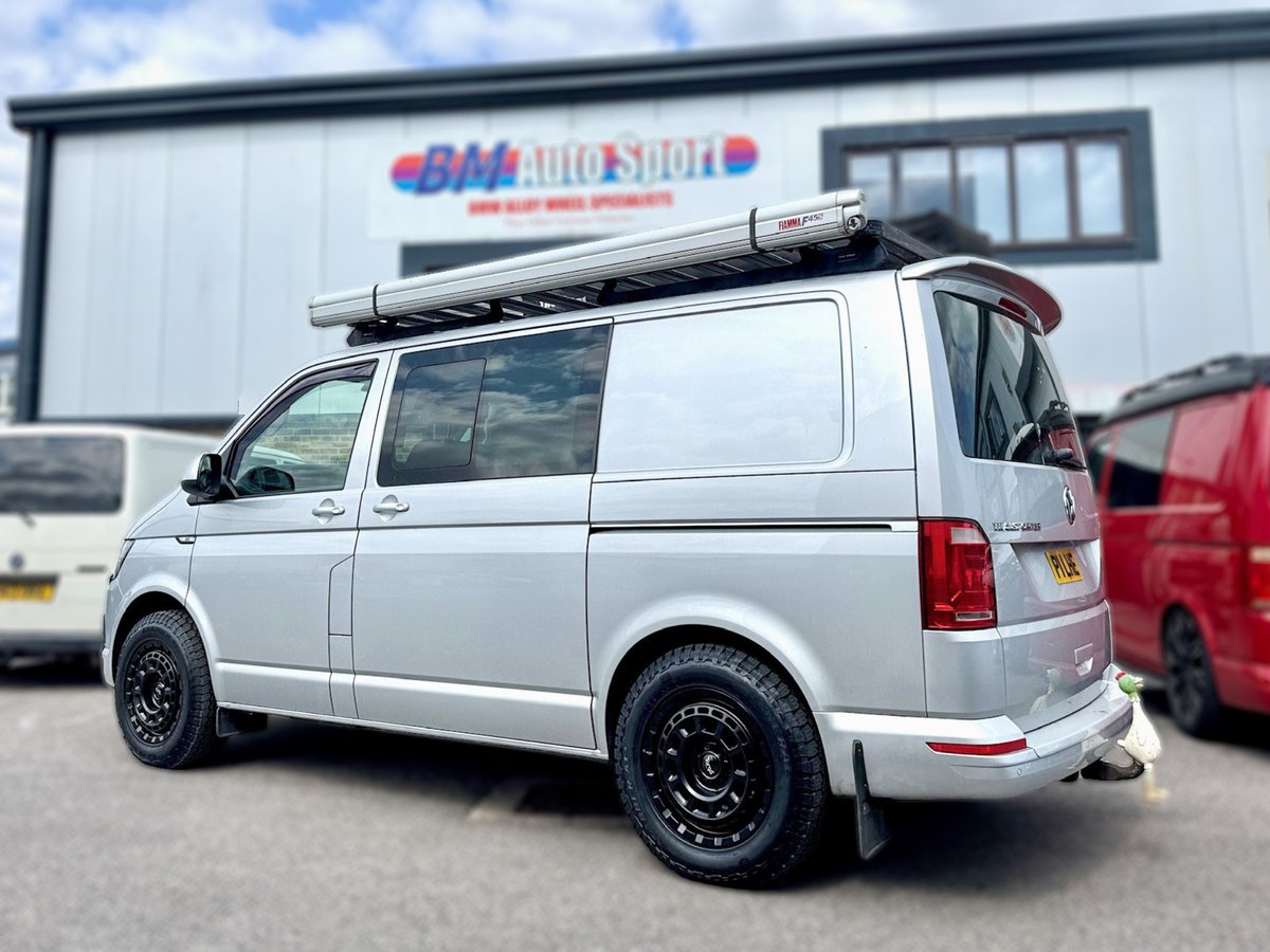HaiMarque's tweet photo. This silver VW Transporter T6 upgraded from steel swamper wheels to 17-inch satin black Targa TG9 alloys with General Grabber AT3 all-terrain tyres—rugged, refined, capable off-road, and impressively quiet for everyday comfort. https://t.co/cs9hE6oKIb