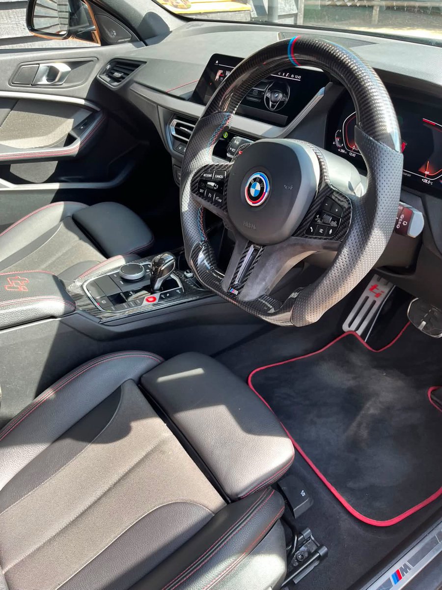 BrynnGleich's tweet photo. The BMW F40 128ti, owned by @badger_128ti. A driver-focused cabin with red-accented sport steering, digital displays, and bolstered styling—built to thrill on every road. https://t.co/fitKZNe7vg