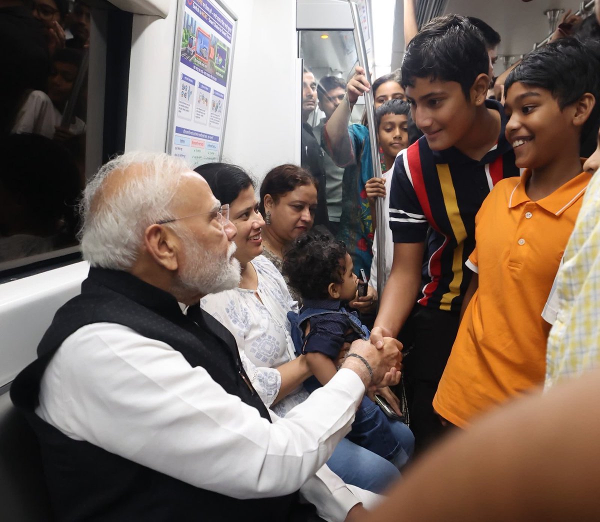 Kausarjahan213's tweet photo. A heartwarming moment as Hon. PM Shri Narendra Modi Ji interacts with his young friends during his journey on the Delhi Metro. 
@narendramodi https://t.co/3GERjTlTC4
