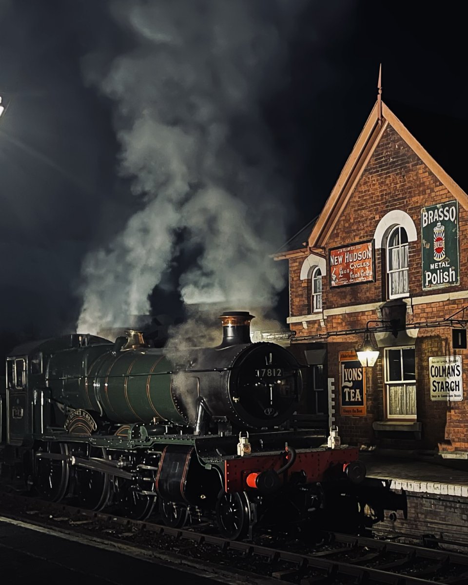 rs_photography9's tweet photo. Midnight Departure 🚂💨

7812 'Erlestoke Manor' simmering at Arley on a cold @severnvalleyrailwayoffical night - steam catching the platform lights, vintage ads glowing, and that perfect hush you only get after dark.

Two edits, same moment.
1/2 https://t.co/pGOSF5iyvf