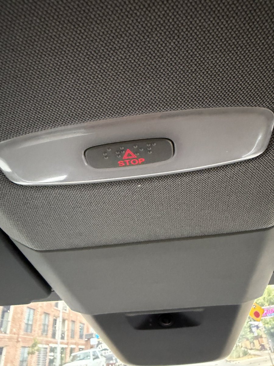 Teslaconomics's tweet photo. Tesla designed the Cybercab so a blind person can ride without needing any help.

And you can see that in the hardware.

Inside the Cybercab, the door release has a warning-triangle door icon and Braille that reads OPEN.

Lift it lightly and the butterfly door opens.

Pull it all the way to the second detent and it becomes the mechanical emergency release, meaning it can still open the door even if the car has zero power.

Your fingers can tell you exactly what it is before you pull it.

Then look overhead.

Between the dome lights is another button.

Braille says STOP.

Press it and Cybercab requests an immediate pull-over, ends the ride, and connects you with Robotaxi Support.

Think about why those two controls matter so much…

There’s no steering wheel.

There’s no pedals.

There’s no driver sitting up front to ask for help.

So Tesla made sure a blind passenger can physically find the two most important controls, identify them by touch, and use them independently.

The Tesla team didn’t stop there…

The doors can also automatically open when your phone approaches it.

The Robotaxi app works with screen readers.

The seats are positioned around wheelchair height.

There’s room in the cabin for a service animal and trunk space for things like a folded wheelchair or cane.

Voice and audio cues can replace information you would normally need to see on a screen.

Cybercab accessibility is a core part of the product and experience design… Elon even told us the goal is to make sure Cybercab meets the needs of the blind.

Tesla even once brought a production Cybercab to the National Federation of the Blind convention in Austin so blind attendees could actually get inside, touch the controls, and experience it themselves.

True autonomy is not true freedom if you still need another person beside you just to use it.

Cybercab is the definition of true autonomy.