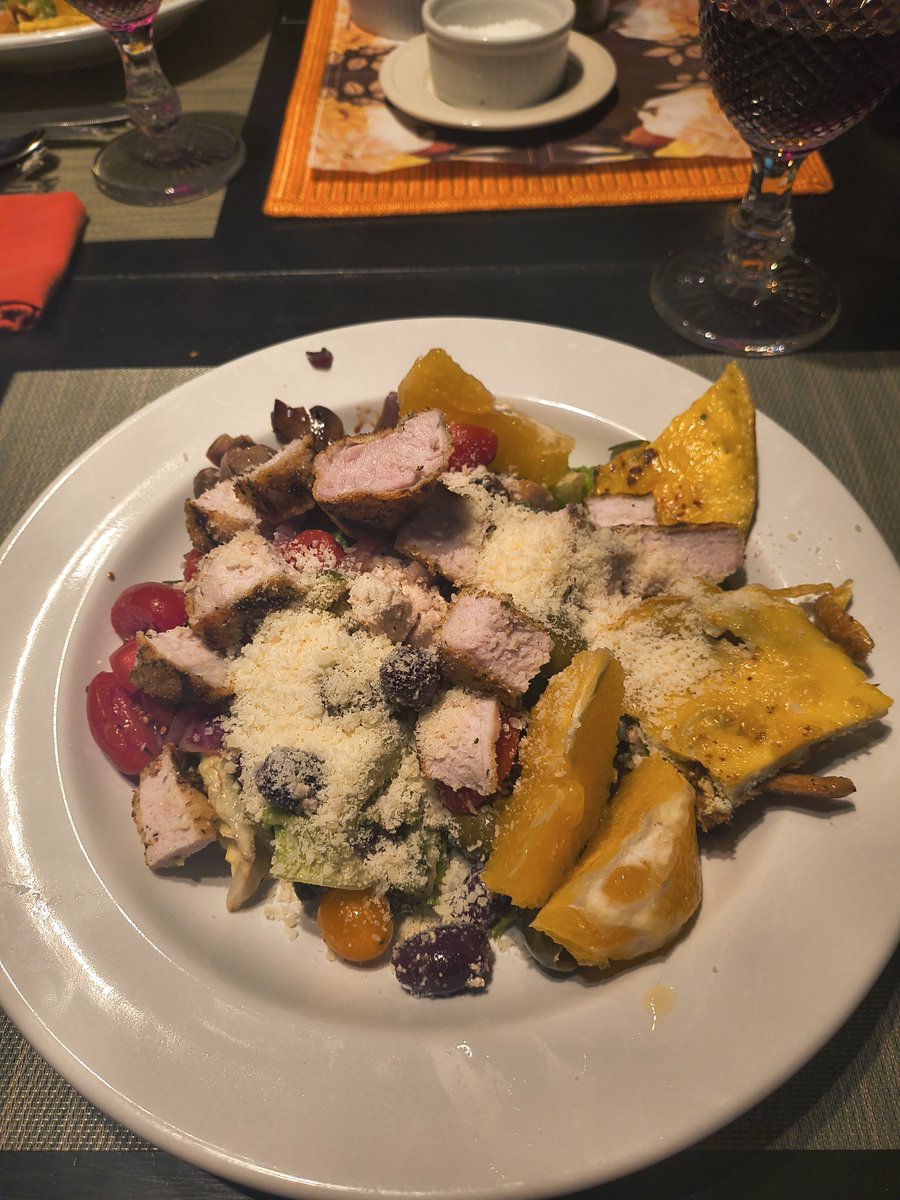 AWerthjr's tweet photo. Weekly family dinner: grand salad constructed with locally grown lettuce and from my garden with cherry tomatoes (my garden) incorporated with on orange memosa dressing further layered with Greek olive and goat cheese, fresh orange slices, sauteed red onion and mushrooms, with grilled beaded pork chop. Yeah, it was good