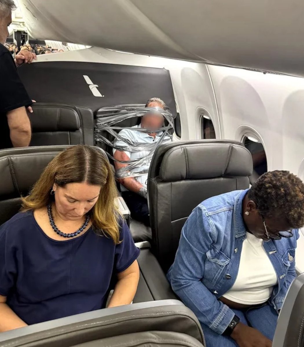 pubity's tweet photo. A 67 year old man got duct taped to his chair after slinging slurs on a flight to New Jersey.

It took 3 men to tie him down, and they landed early so police could quickly arrest him. https://t.co/u97VQazDNZ