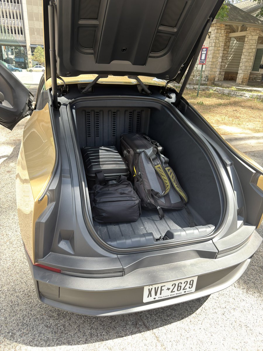 SawyerMerritt's tweet photo. Cybercab luggage test. Plenty of room for larger items. https://t.co/zkm44TqieX
