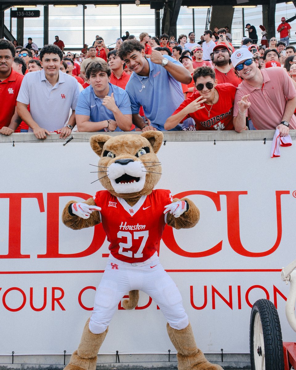 Shasta poses with fans at TDECU Stadium.