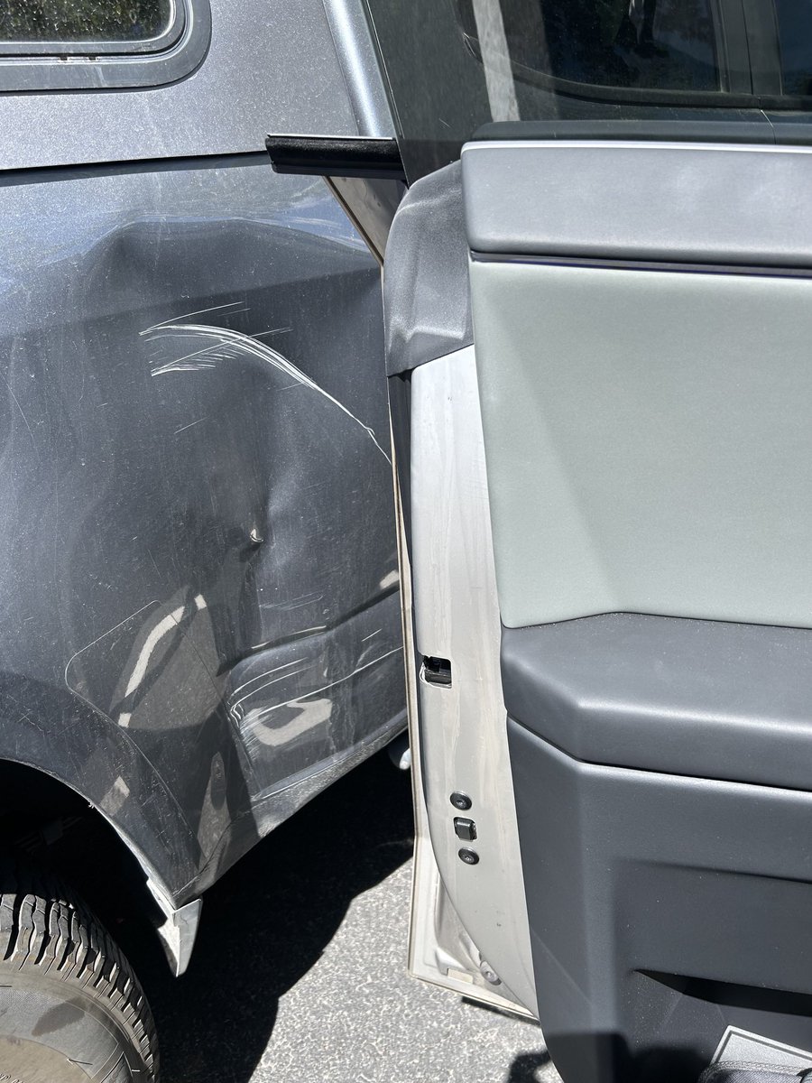 trgoodman79's tweet photo. Opened the door of my @cybertruck a bit too hard and basically destroyed this old Tundra. #cyberding my bad https://t.co/DpT0oF3bYF