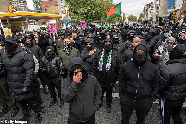 AjaTheEmpress's tweet photo. I do feel the need to point out that these are all the same picture:

1) Men in Dover today
2) Muslim men
3) Trans rights activists
4) Antifa

Some people only seem to have noticed or cared about No. 1.

I don't like any of it, regardless of who's doing it or what label is attached to them.

It is intimidating AF when you're on the wrong side of a group like this, and sadly, like many other women, I have experienced that from groups 3 and 4.

The standard should be the same for everyone. No face covering allowed.