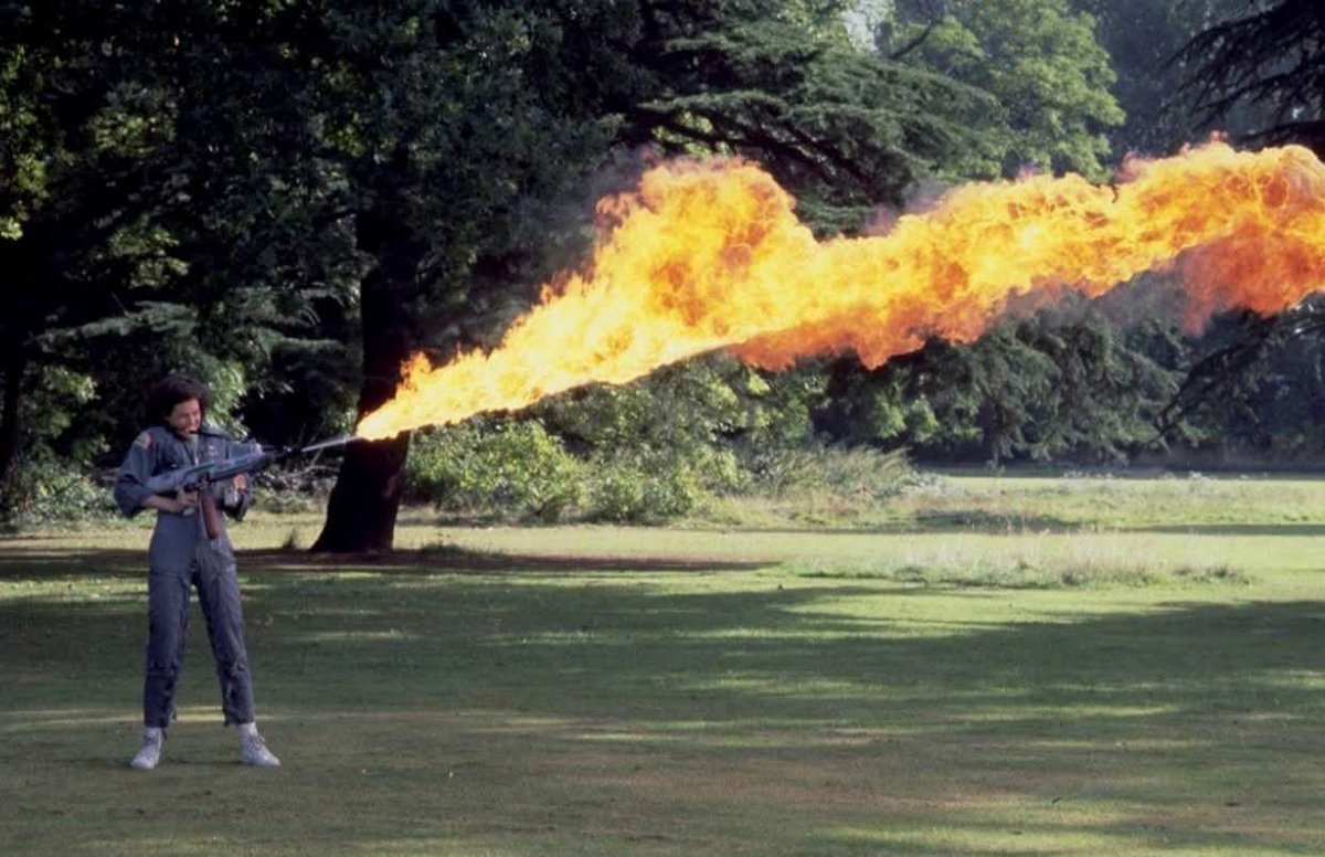 histories_arch's tweet photo. Actress Sigourney Weaver, testing the flamethrower used in the film Alien, 1978.... 

Sigourney Weaver trained with practical effects equipment during production of Alien, directed by Ridley Scott.

The production relied heavily on practical effects rather than CGI, including real pyrotechnics, mechanical props, and full-scale set builds. Flamethrowers used on set were adapted from real industrial equipment and controlled under strict safety protocols, with fire effects coordinated by licensed technicians.

Weaver’s role as Ellen Ripley marked her first major film appearance, and the film went on to gross over $100 million worldwide, becoming one of the most influential science fiction films of its era.

The creature design by H. R. Giger earned the film an Academy Award for Best Visual Effects, highlighting the impact of practical, handcrafted effects in pre-digital filmmaking.

#archaeohistories