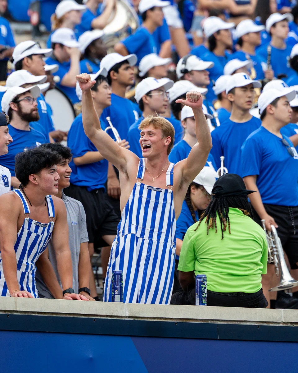 Duke student cheering at Duke football game.