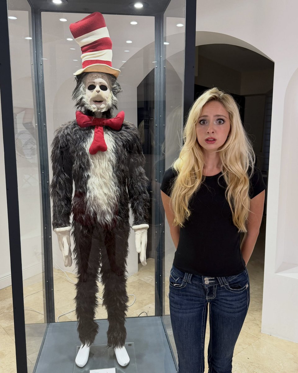 Complex's tweet photo. Natalie Reynolds won the screen used Cat in the Hat costume at auction for $25K and says it’s ‘haunted.’ 

She was reportedly told never to look it in the eyes, while rumors claim Mike Myers’ soul is trapped inside. She’s also considering testing the costume to see if its hair is actually human.

[📸: via/ realnatalierey]