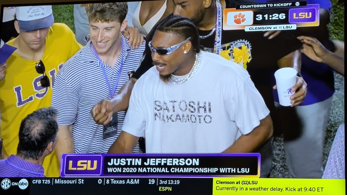 BleevesOfficial's tweet photo. Justin Jefferson wearing a Satoshi Nakamoto shirt at the LSU game! https://t.co/Df5ee6BzbJ