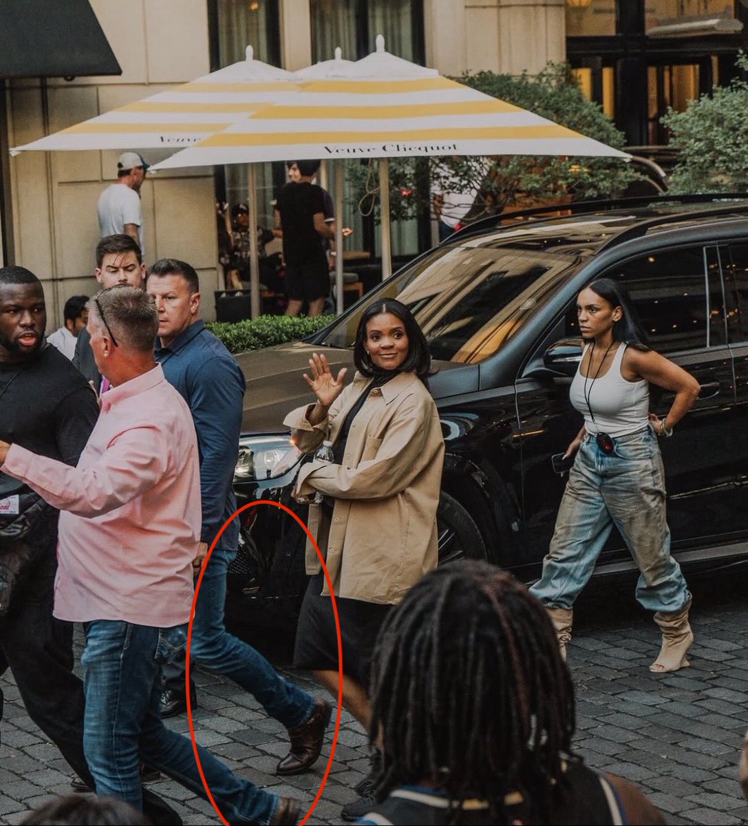 ErikaCA47's tweet photo. Omg. Candace’s security are BOTH wearing button-down shirts, dark jeans, and dark brown shoes. 😱😱

Were they in on killing Charlie Kirk too?! 

"We don’t know but we knowwww."