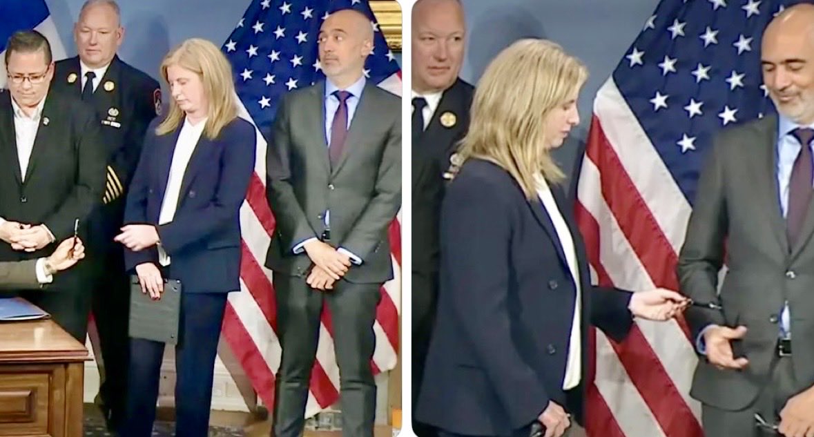 DavidAsmanfox's tweet photo. From the NYPOST: After Mayor Mamdani signed the 9/11 documents, he gave Police Commish Tisch the ceremonial pen, and whispered, “Can you pass this?”
Tisch handed it to Mamdani’s chief counsel, Ramzi Kassem, who once represented an al-Qaeda terrorist with links to the 9/11 attack on the Pentagon, and who had just snuck into the press conference.
She then hurried out of the room — the first official to exit the press conference.

This childish, calculated display of passive aggression was missed by no one, and will not be forgotten by Tisch or by NYC’s millions of 9/11 survivors.