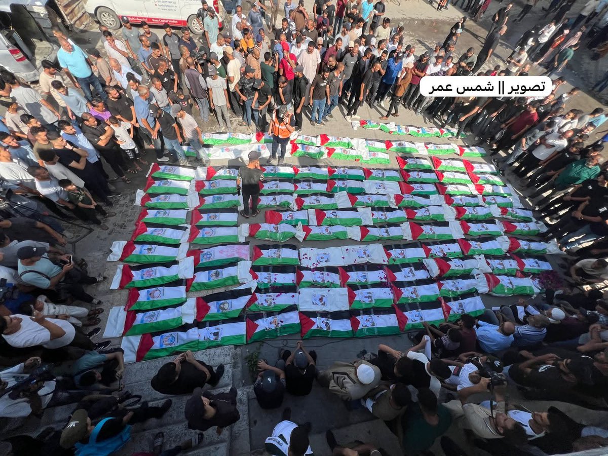 AyahTranslates's tweet photo. A mass funeral has just begun for the remains of 100 martyrs killed in an Israeli airstrike on the Al-Zaytoun neighborhood in Gaza back in 2023.
 
70 of them were CHILDREN. 

Their bodies had remained trapped under the rubble for nearly 3 years. https://t.co/YtrLdnr8lD