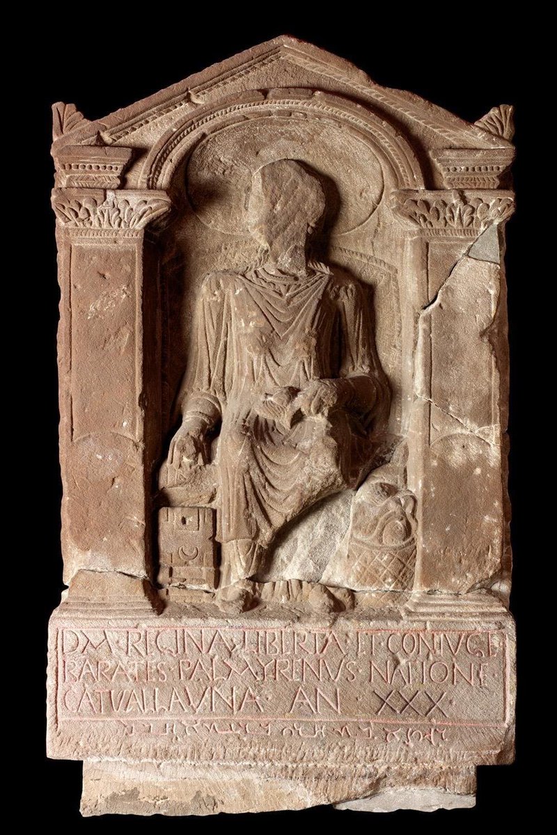 RomanBritainHQ's tweet photo. This British woman was enslaved, freed — then mourned in two languages.
Regina’s grave monument stands at South Shields, but the few words cut into it place her life across an extraordinary stretch of the Roman world.

She was a Catuvellaunian, from the people whose territory centred around what is now St Albans. At some point she was enslaved by Barates, a man from Palmyra in Roman Syria.

The stone does not tell us how Regina became enslaved, how the two met or what that unequal beginning meant for their relationship. What it does say is that Barates later freed her and called her his wife.

They ended up near Arbeia, the Roman fort at South Shields. Regina died there aged just 30.

Barates then had an unusually elaborate memorial made.

Regina is shown seated in a high-backed wicker chair. She wears jewellery and holds spinning equipment in her lap, while a basket of wool sits beside her and she opens a locked box for valuables.

Those details are not a photograph of her daily life. They were carefully chosen signs of status, prosperity and the Roman ideal of a respectable wife. Even the carving mixes worlds: the monument has familiar Romano-British features, while other details echo Palmyrene art.

Then come the words.

The main inscription is in Latin. It names Regina, calls her Barates’s freedwoman and wife, identifies her as a Catuvellaunian and gives her age.

But beneath it the mason cut another line, this time in Palmyrene Aramaic, the language of Barates’s homeland.

“Regina, the freedwoman of Barates, alas.”

That final word feels startlingly intimate, but even here the evidence needs care. This kind of lament was a recognised funerary formula at Palmyra, not proof of a private sentence spoken in grief.

There is another clue in the carving itself. The Palmyrene lettering is more confident than the Latin, where the mason even corrected part of the word for Regina’s tribe. Specialists have argued that the sculptor may also have come from Palmyra.

So one monument at the edge of Roman Britain preserves a British woman, a Syrian man and perhaps a Syrian stone-carver in the same piece of stone.

It is not a tidy Roman love story. Regina had first been Barates’s slave, and the monument cannot tell us what their marriage was like.

What survives is stranger and more human than that: her name, her age, the distance both lives had travelled — and one word carried from Syria to South Shields.

Alas.