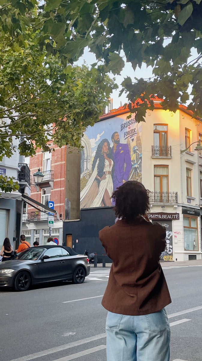 odopama's tweet photo. A few weeks ago, while taking a stroll through Sint-Gillis, a friend &amp; I came across this huge mural. We were both astonished, asking: “How often do you get to see Black love celebrated like this?” Today, I discovered it was created to celebrate the love of @badassboz &amp; Watson ❤️ https://t.co/dZOpHuwUo5