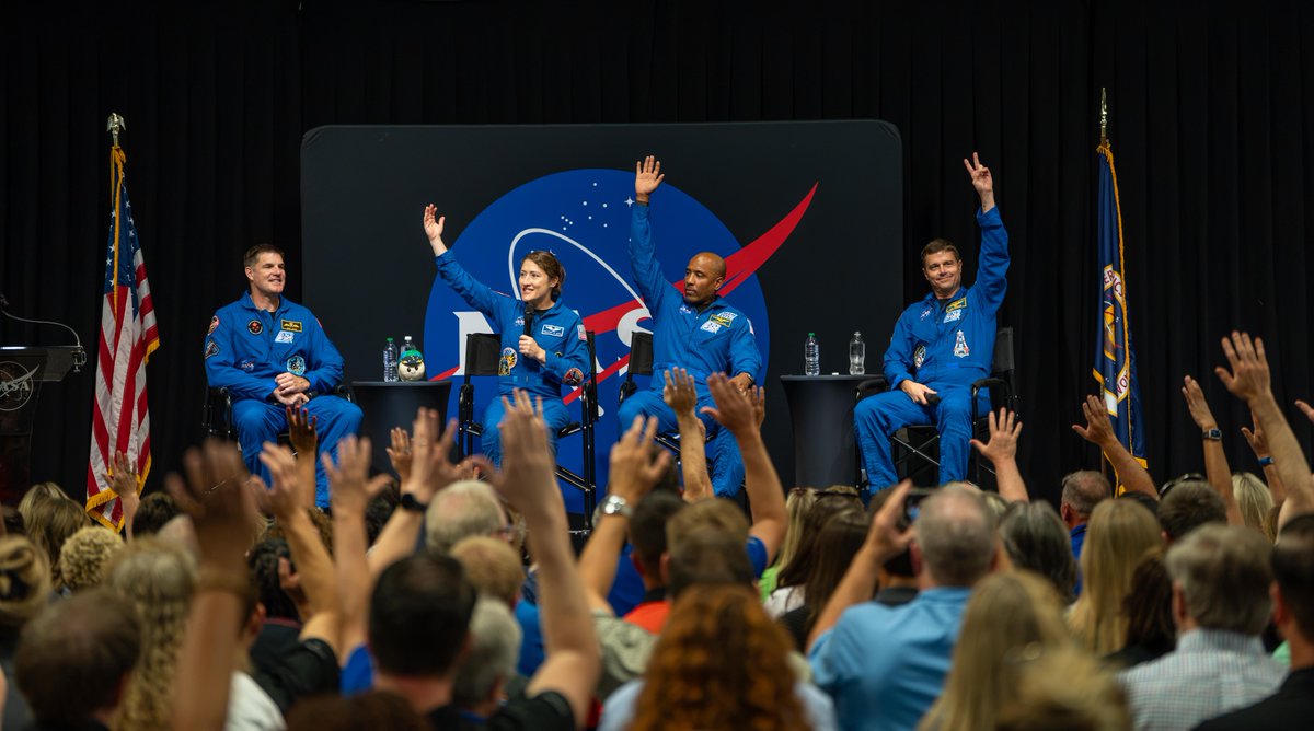 The crew of NASA’s Artemis II mission – NASA astronauts Reid Wiseman, Victor Glover, and Christina Koch, and CSA (Canadian Space Agency) astronaut Jeremy Hansen – visited Huntsville, Alabama, Tuesday, Aug. 1, where they met with the NASA workforce at NASA’s Marshall Space Flight Center. In this image, the crew sit on stage with their hands raised facing a crowd of NASA Marshall eployees who also have their hands raised. Credit: NASA/Brandon Hancock