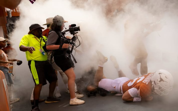 SanstinTX's tweet photo. Photographer Ysa Mendoza captured this shot of Arch Manning falling over a videographer during the Texas runout.'

Give her a follow on IG at ysa24.png, and she also works for The Daily Texan https://t.co/NPRWnAwefw