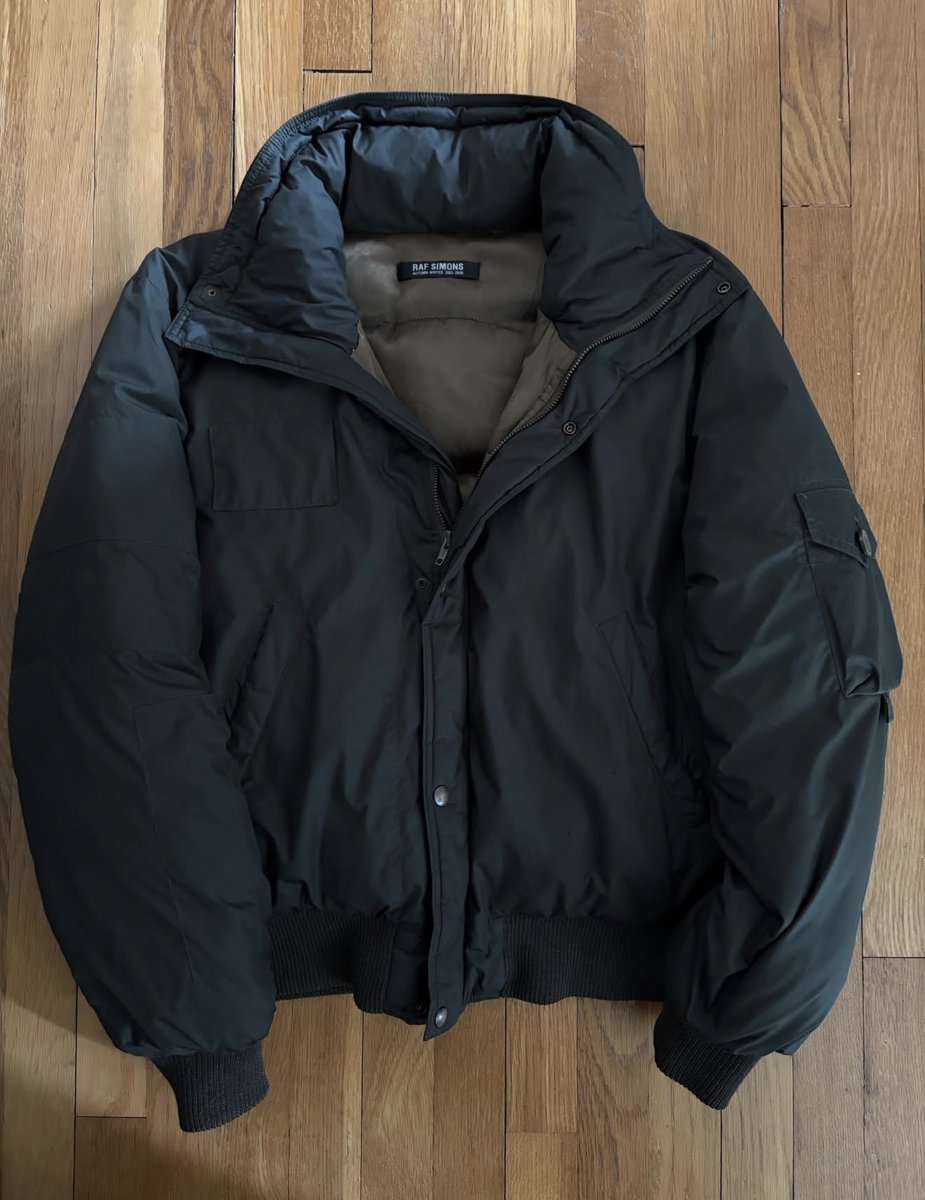 theattractmag's tweet photo. raf simons AW05/06 “history of my world” goose-down bomber jacket

best of raf simons archive https://t.co/3jcrLQPlc3