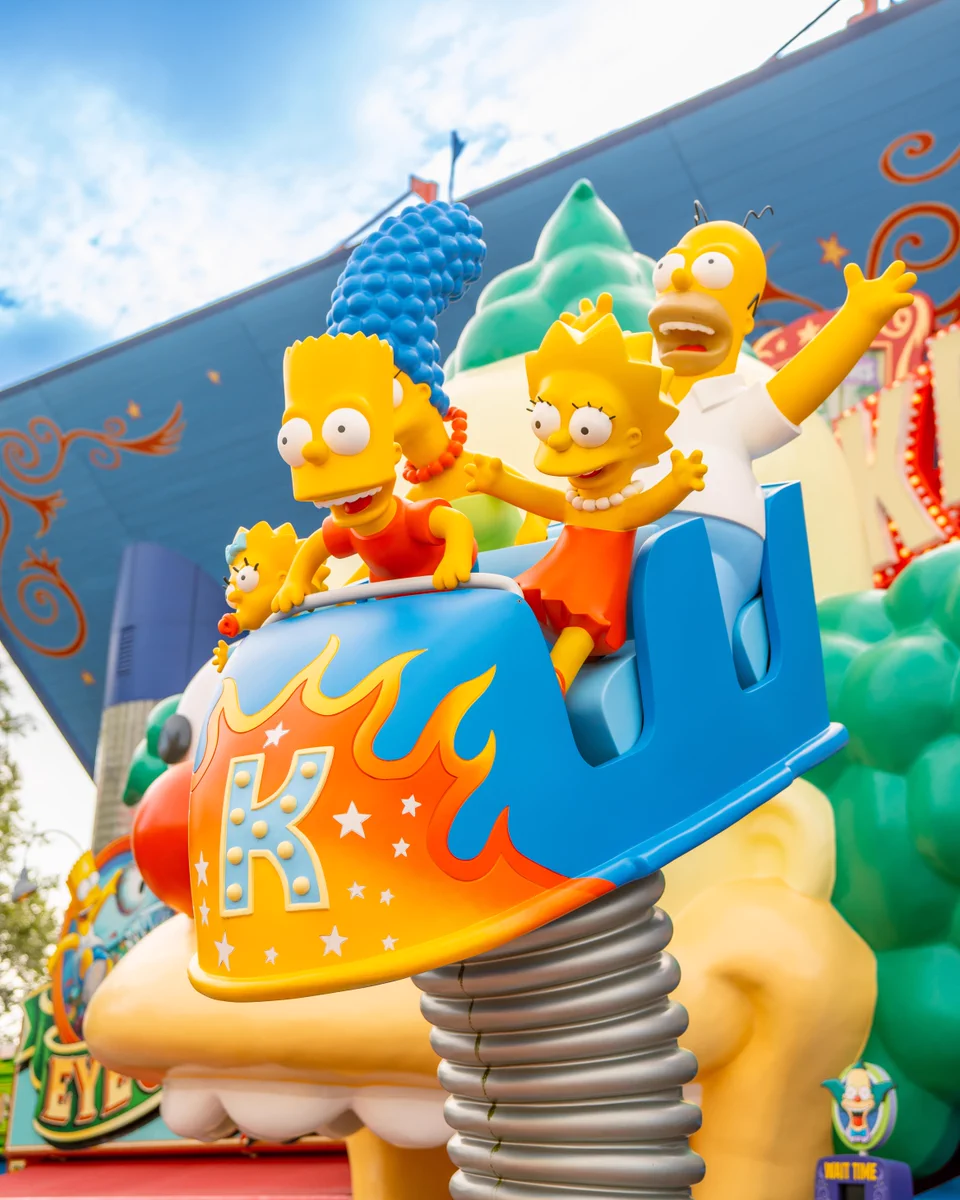 Photo of The Simpsons on a ride. 