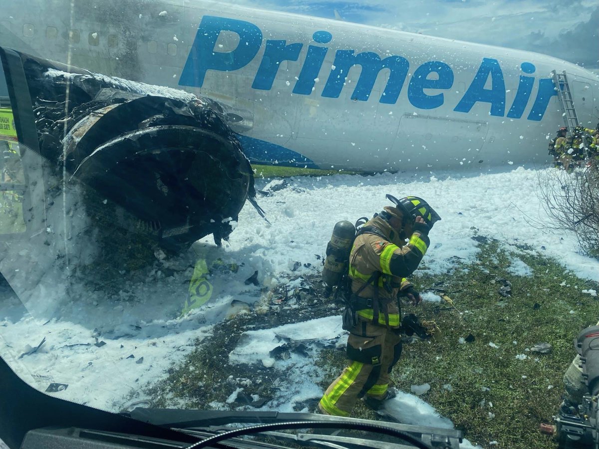 Breaking_Battle's tweet photo. BREAKING: An Amazon Prime Air cargo plane overran the runway while landing at Miami International Airport Sunday afternoon, crashing into multiple vehicles and erupting in flames. More than 60 fire rescue units responded, and officials reported multiple patients as a full ground stop was issued at the airport. The cause of the crash remains under investigation.

#BreakingNews #Miami