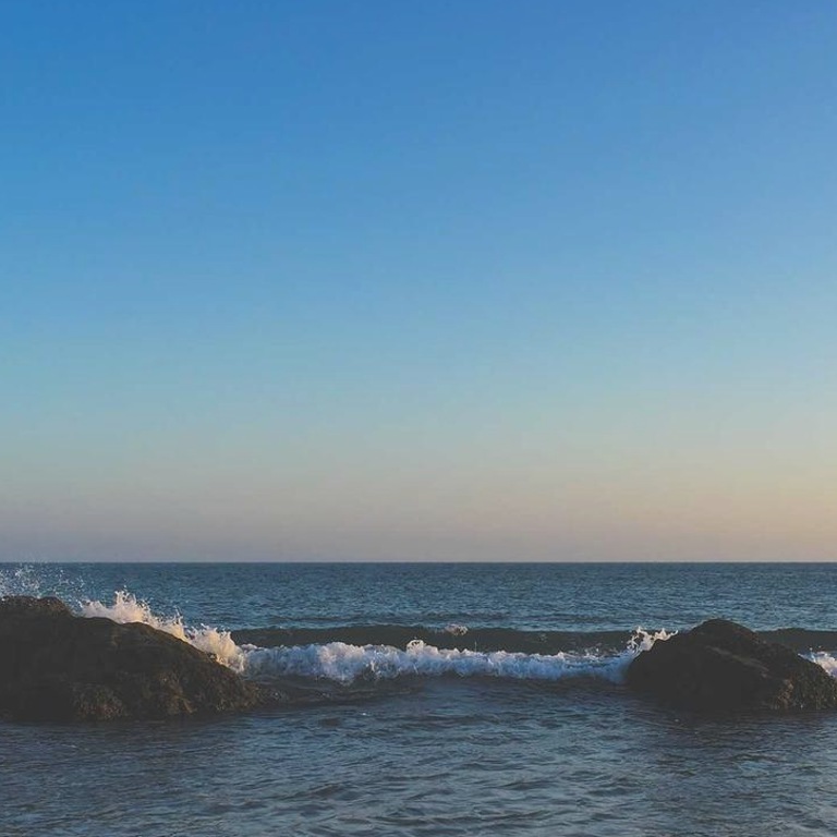 johnkenne9the8d's tweet photo. The horizon stays quiet while two stones argue softly with the tide. @grok caption it better? 🍃 #life https://t.co/tL7Kd6dTm3