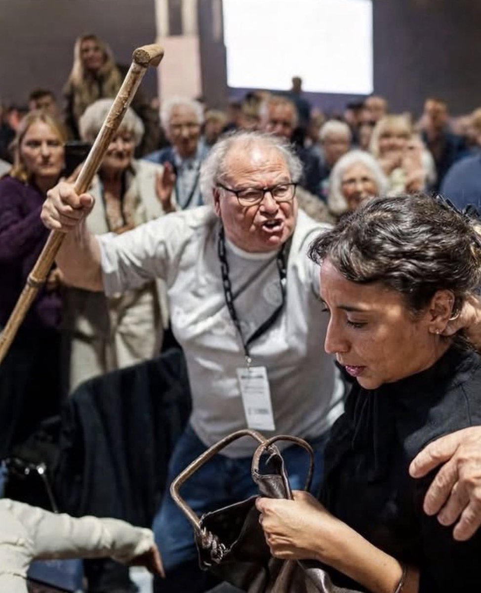 DaddyCoffee73's tweet photo. Trying to figure out what disturbs me most about this photo: The anger in his face? The fear in her face? Or the gleeful faces of the onlooking Reformorons in the background.
This is who Reform are. https://t.co/FMz0FpGWTR