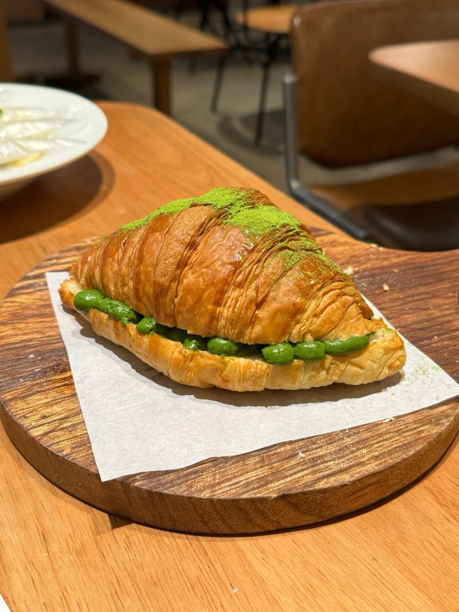 AVNISH64627920's tweet photo. Just found the BEST matcha croissant in town at that tiny café on 5th St. Flaky layers oozing with creamy matcha filling – totally worth the 20-minute wait! https://t.co/VOHJbTGAeZ