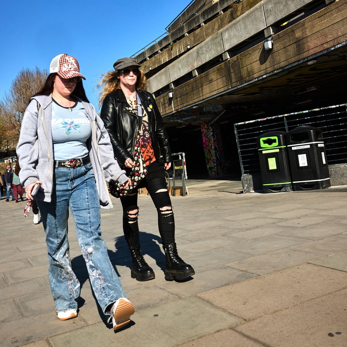Liz2011mabel's tweet photo. Two women move through the frame with purpose, embodying the energy and style of the street. https://t.co/U22D4ldpri