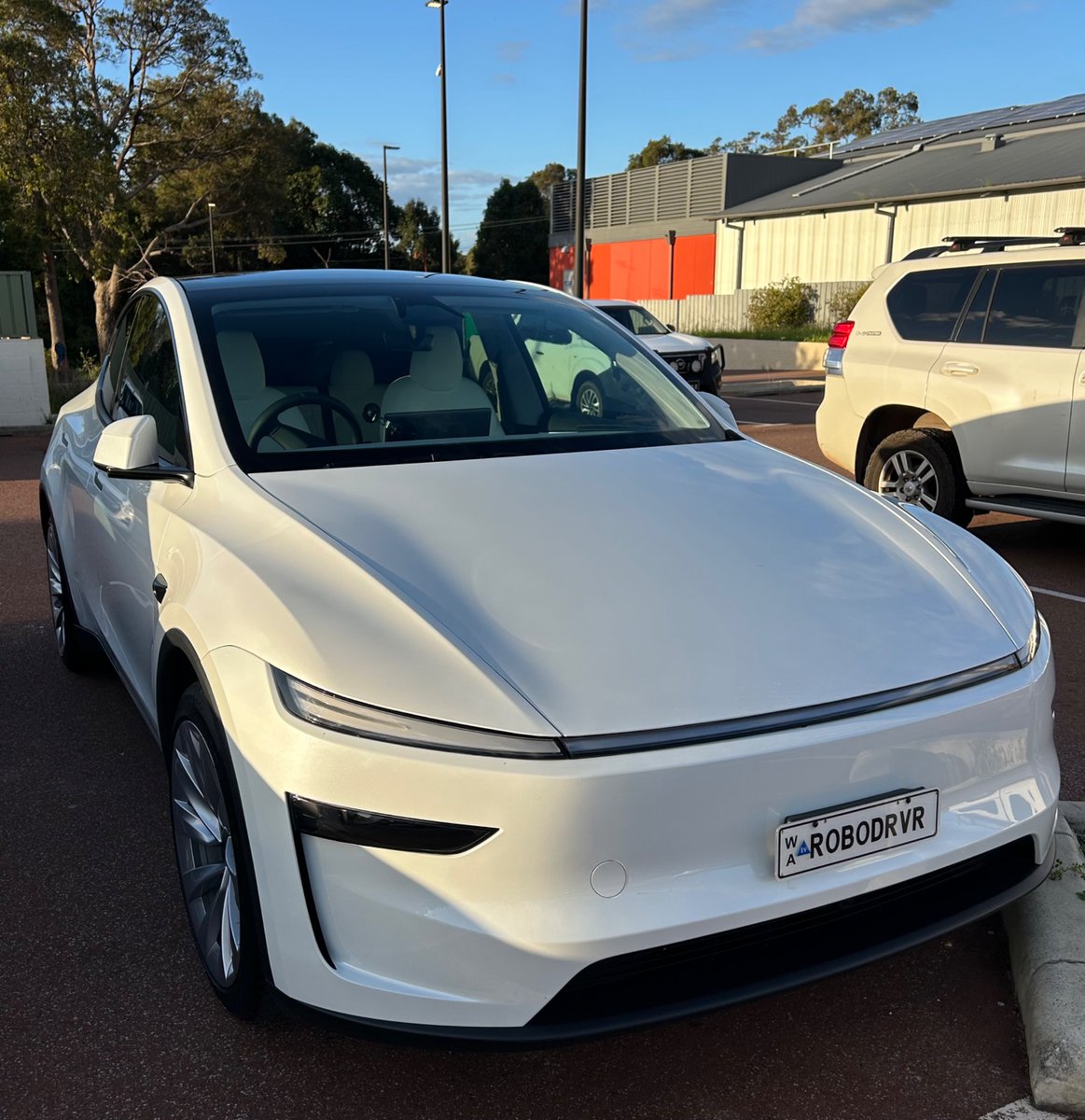 DougSmart's tweet photo. I just had my wheels rotated. Been going to the same place for a few years. The manager asked me why I had upgraded my Tesla from my 2023 Model Y (HW3). I said because this one drives itself. He said, “yeah, like highways, right?” I lolled and said “no mate, come for a drive”. So he did. Blown away. Had no idea this was a thing. 

After about 5 minutes he asks which Teslas can do this etc. Says his brother has a Model 3. I ask when he bought it, he says last year. I say it can do it, he just needs to subscribe and download the software. More blown away. Like 🤯😱 blown away. I invited him to have his brother contact me if he needed any help. 

We park and I fire up YouTube and show him Cybercabs in Austin. He like Whaaaaa?? 😂 💪🏻 🔥

We’re so early.