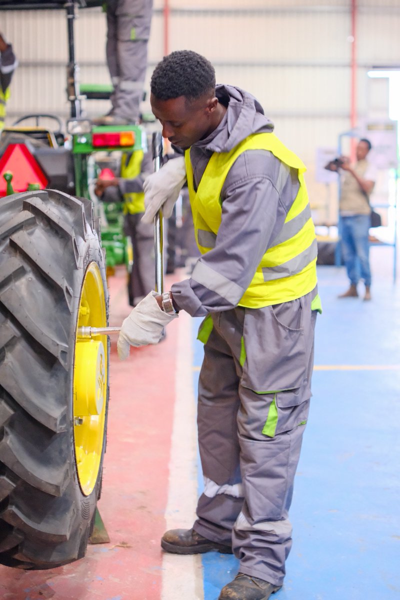 AsstSecStateAF's tweet photo. In Shashemene, Assistant Secretary Garcia saw firsthand the strong demand for high-quality John Deere tractors, with hundreds of pre-sold units ready for delivery at the Kegna Agricultural Equipment Manufacturing factory. Accompanied by Oromia Region President Shimelis Abdisa and Shashemene Mayor Adane Tekle Giorgis, Assistant Secretary Garcia also discussed how peace and security are key to unlocking more investment opportunities.