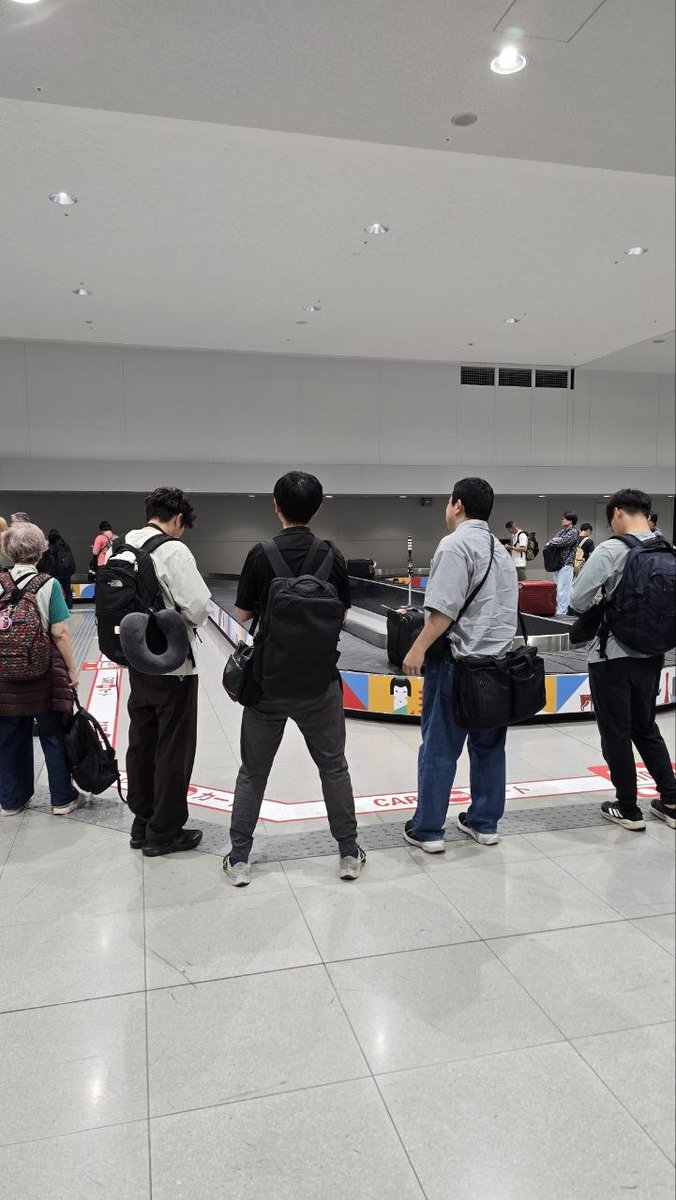 jeremybernier's tweet photo. Japan vs. the rest of the world can be summarized by airport baggage claim.

Rest of the world: Pure chaos + suboptimal Nash equilibrium. People wait directly in front of the conveyer belt, which means that nobody behind them can find or grab their luggage. People act in their own individual self-interest without any thought to anyone else. When enough people act like like this, then everyone else also has to act selfishly just to survive. Ultimately the collective is worse off, and the most selfless are the most punished.

Japan: People wait at a distance to the belt (clearly marked, though I think Japanese would do so even if it weren't), allowing everyone to find and grab their luggage with minimal hassle. Attendants nearby quickly check ID with baggage tags to confirm that nobody grabs the wrong bag, and this is done so efficiently that it doesn't add any noticeable delay.

It's common sense to anyone who's thought about this that maintaining a minimum wait distance from the conveyer belt is the optimal way to run it. Yet almost nowhere in the west have I seen this (I think I saw it once in one of the Scandinavian countries - maybe Finland - which also happens to be the European country most similar to Japan).

Imagine that it's literally someone's job to manage an airport - likely paid by your taxpayer dollars, and they haven't managed to figure out that you can make everyone better off by putting a line on the floor enforcing a minimum distance to the conveyer belt.

It's worth emphasizing that the suboptimal equilibrium rewards selfish behavior and punishes selfless behavior. If you want to be the altruistic role model that maximizes everyone's experience by waiting at a respectable distance, people will just crowd around the conveyer belt in front of you, and you'll no longer be able to find or reach your bag.

I was amongst the first to arrive at the baggage claim in SFO, waited at a distance, but of course everyone ended up crowding around the belt, making it almost impossible to see or grab a suitcase without having to tell somebody to move. Luckily I managed to find a tiny opening in the human conveyer belt centipede chain where I managed to spot my suitcase. Knowing I only had a small window of opportunity, I rushed to the belt, and in my haste to secure my bag, pushed too forcefully and nearly cracked my nail, with blood coming out underneath. Boo hoo. I still feel it in my middle finger as I type this, but it'll recover soon. At least I got my suitcase.

Baggage claim is just one example amongst countless. Escalators are the other obvious one. Japan is the only country I've been where people consistently wait on one side of the escalator to allow others to walk the other side.

Somebody tell the airport managers to put the minimum wait distance line around the baggage conveyer belts because I guess they haven't gotten the memo yet.