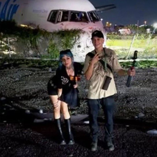 6ixbuzztv's tweet photo. A streamer is receiving backlash after they took a photo with the wreckage of the Amazon cargo plane crash in Miami.

5 people died in the crash, and 5 others were seriously injured. https://t.co/8V1c3Gw48D