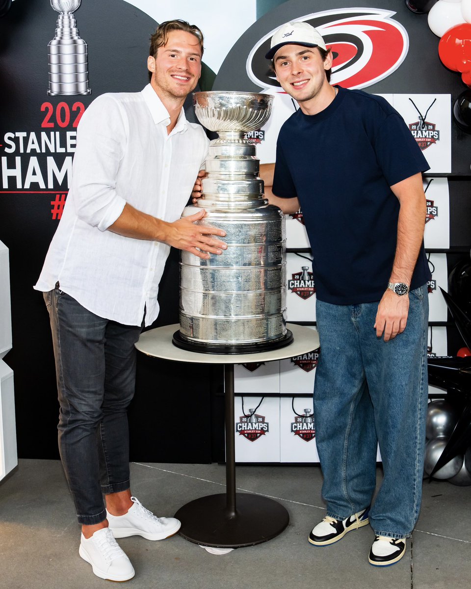 Photo of Andrei Svechnikov and Pyotr Kochetkov and the Stanley Cup during Andrei’s day with the trophy