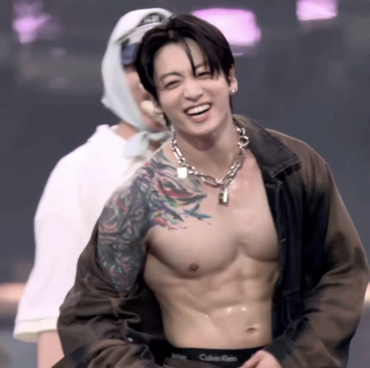 ARMYMomIR2020's tweet photo. Remember the days when Jungkook had to hide his tattoos by wearing dishwashing gloves?  Times have really changed 😂 https://t.co/0gSgKsZUcN